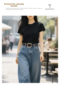 Close-up of stylish black PU leather belt with a large gold square buckle on blue jeans