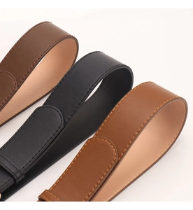Close-up of three 3.8cm leather belts in black and brown with detailed stitching and matte finish