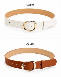 Close-up of white and camel PU leather belts with irregular oval gold metal buckles