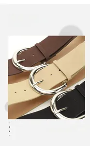 Close-up of three PU suede belts in coffee, beige, and black with silver metal buckles