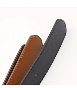 Close-up of black and brown leather belts with fine stitching details and rounded edges