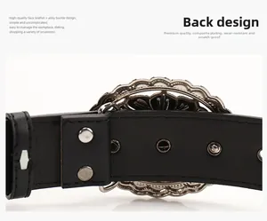 Detail of western belt back showing silver rivets and intricate hollow buckle design