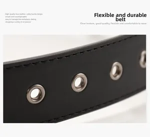 Close-up of black faux leather western belt with silver alloy eyelets and stitching
