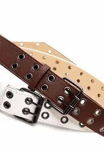 Detail of retro double-eyelet leather belts with metal double-pin buckles in brown and white