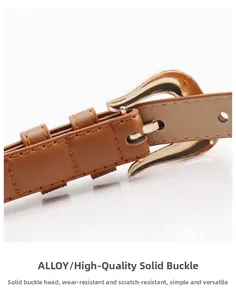 Detailed close-up of brown leather belt with gold solid alloy horseshoe buckle and stitching