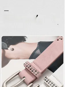 Detail of matte pink and white leather belts with double-row metal rivet studs and pin buckle