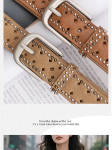 Detail showing two brown leather belts with metal studs and star cutouts on magazines
