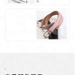 Detail of pink punk style leather belt with double row studs and silver metal buckle