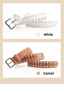 Close-up detail of punk style grommet belts in white and camel colors with metal eyelets