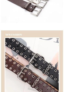 Detailed close-up of punk style metal eyelet belt with silver buckle on PU leather strap
