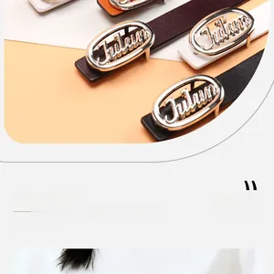 Detail view of fashion leather belts with silver Future letter buckles in multiple colors