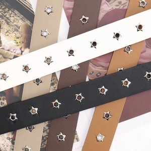 Punk style women's faux leather belt featuring star shaped metal eyelets in multiple colors