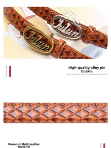 Detail view of brown faux leather belt with diamond quilt pattern and golden buckle