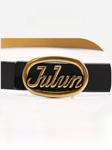 Detail of black leather belt featuring an oval golden alloy buckle with Julun engraving
