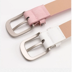 Close-up of pink and white matte leather belts with silver matte metal pin buckles