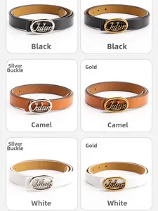 Detail view of genuine leather belts in black camel and white with oval metal buckles