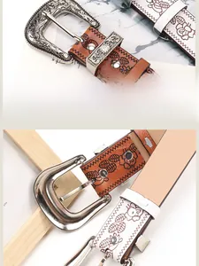 Detailed close-up of floral embossing on vintage style leather belts with alloy buckles