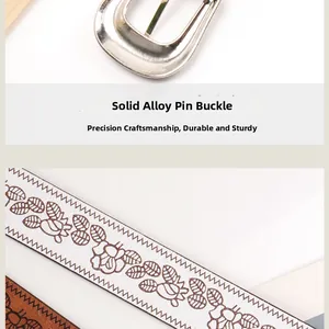 Detail view of floral embossed white leather belt with a solid silver alloy pin buckle