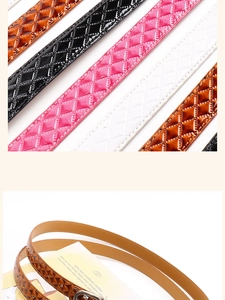 Detail of slim patent leather belt with quilted diamond pattern and silver buckle