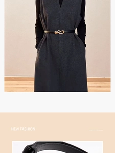 Détail d'une fine ceinture en cuir noir avec boucle cœur dorée sur une veste