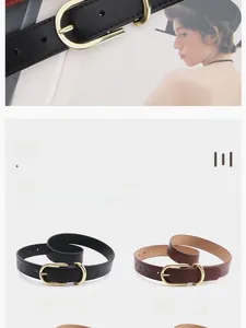 Detail view of thin fashion belts in black and coffee with golden oval metal buckles