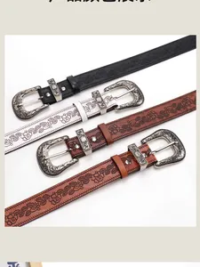 Detail of western vintage embossed belts with floral patterns and silver carved buckles