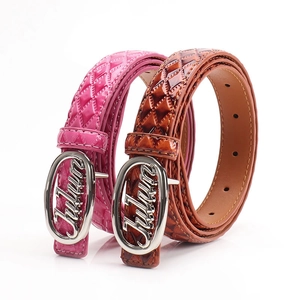 Women's quilted patent leather belts in pink and brown with silver metal buckles