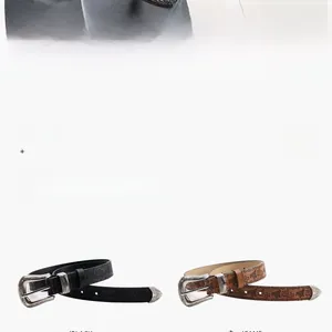 Détail de ceintures en cuir vintage avec boucles occidentales en noir et marron
