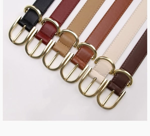 Detailed flat lay of slim alloy belts in six colors with elegant gold buckles