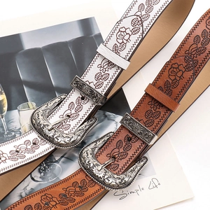 Vintage floral embossed leather belts in white and brown with engraved silver metal buckles