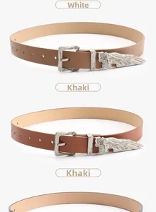 Close-up of Western vintage engraved silver buckle and belt texture in white and khaki
