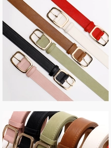 Detailed macro view of thin PU leather belts with gold alloy buckles in various colors