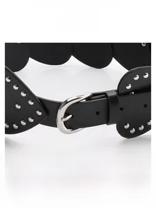 Detailed view of black Y2K heart belt with silver rivets and wavy edge trim