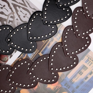 Y2K vintage punk belt featuring heart-shaped leather patches with silver metal rivets