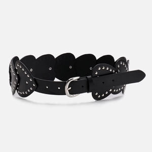 Vintage Y2K heart rivet belt featuring black leather segments and punk silver studs