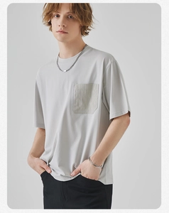 Detailed view of light gray men's cotton T-shirt featuring a unique chest pocket design