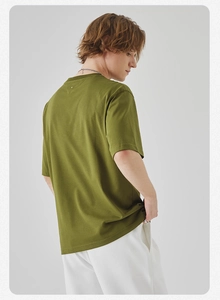 Detail view of the olive green cotton blend T-shirt showing back cut and side silhouette