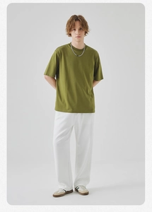 Detail of olive green short sleeve T-shirt with premium cotton texture and loose fit cut