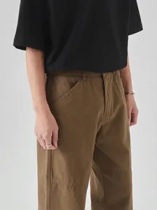 Men's khaki cotton cargo pants in a loose straight fit with utility side pockets