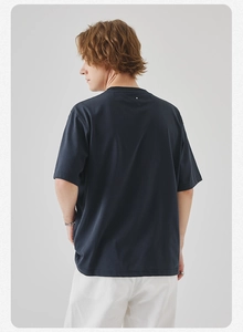 Rear view of men's navy blue crew neck T-shirt showing minimalist back neck detail