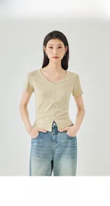 Detailed close-up of V-neck apricot slim fit short sleeve tee with buttons and ribbed texture