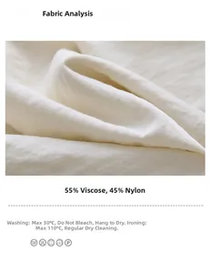 Macro del tessuto bianco sporco, 55% rayon 45% nylon con dettagli sulla cura del capo
