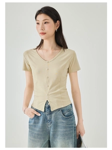 Detail of light yellow V-neck short sleeve tee with front buttons and slim fit hem slit