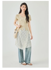 Detail of V-neck short sleeve top with lace layered skirt and light wash denim jeans
