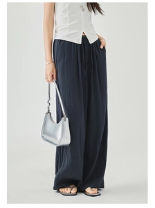 Close-up of high-waist drawstring waistband on flowing wide-leg casual pants