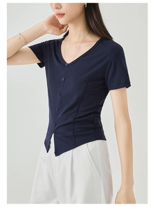 Close-up of navy V-neck short sleeve top with button detail and slim-fit ribbed fabric