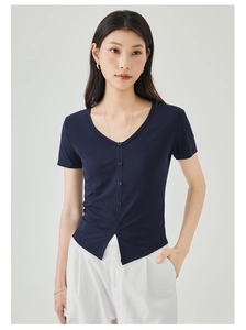 Close-up of slim-fit navy blue V-neck knit top with button detail and split hem design