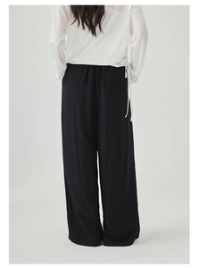 Minimalist black wide-leg trousers for women with high waist and decorative back pockets