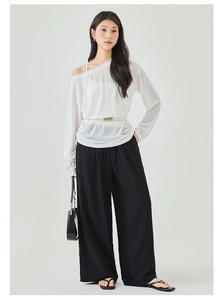 Full view of women's black high-waisted wide-leg trousers with elegant white belt detail