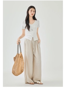 Full-body shot of white V-neck slim top and beige wide-leg pants for a summer outfit